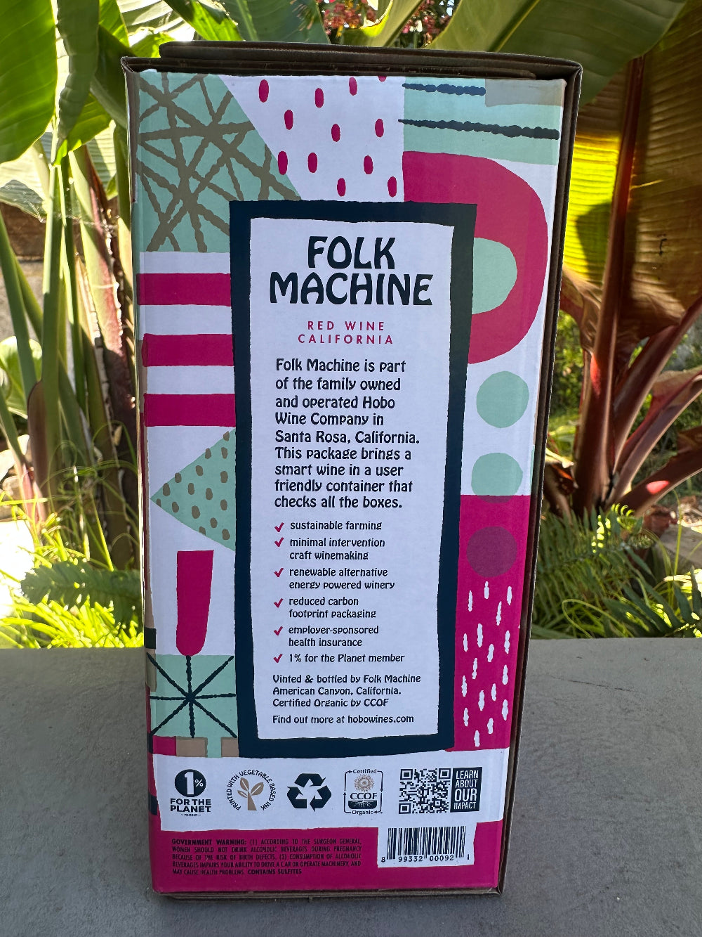 Folk Machine wine box with decorative design on a natural background