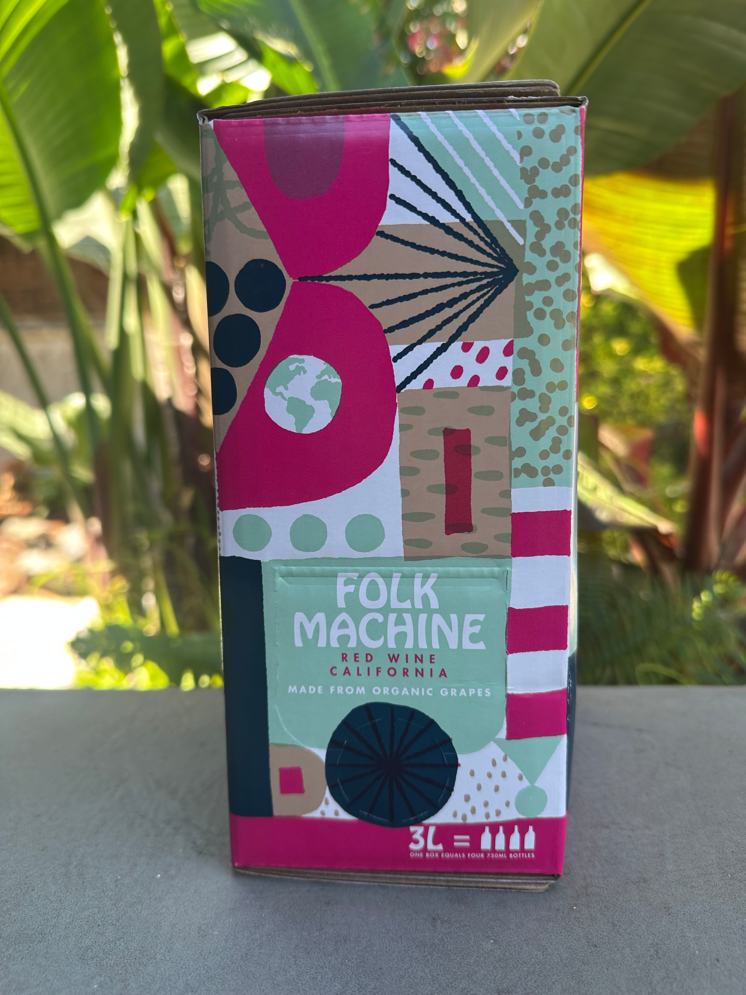 Colorful box with abstract design on a gray surface